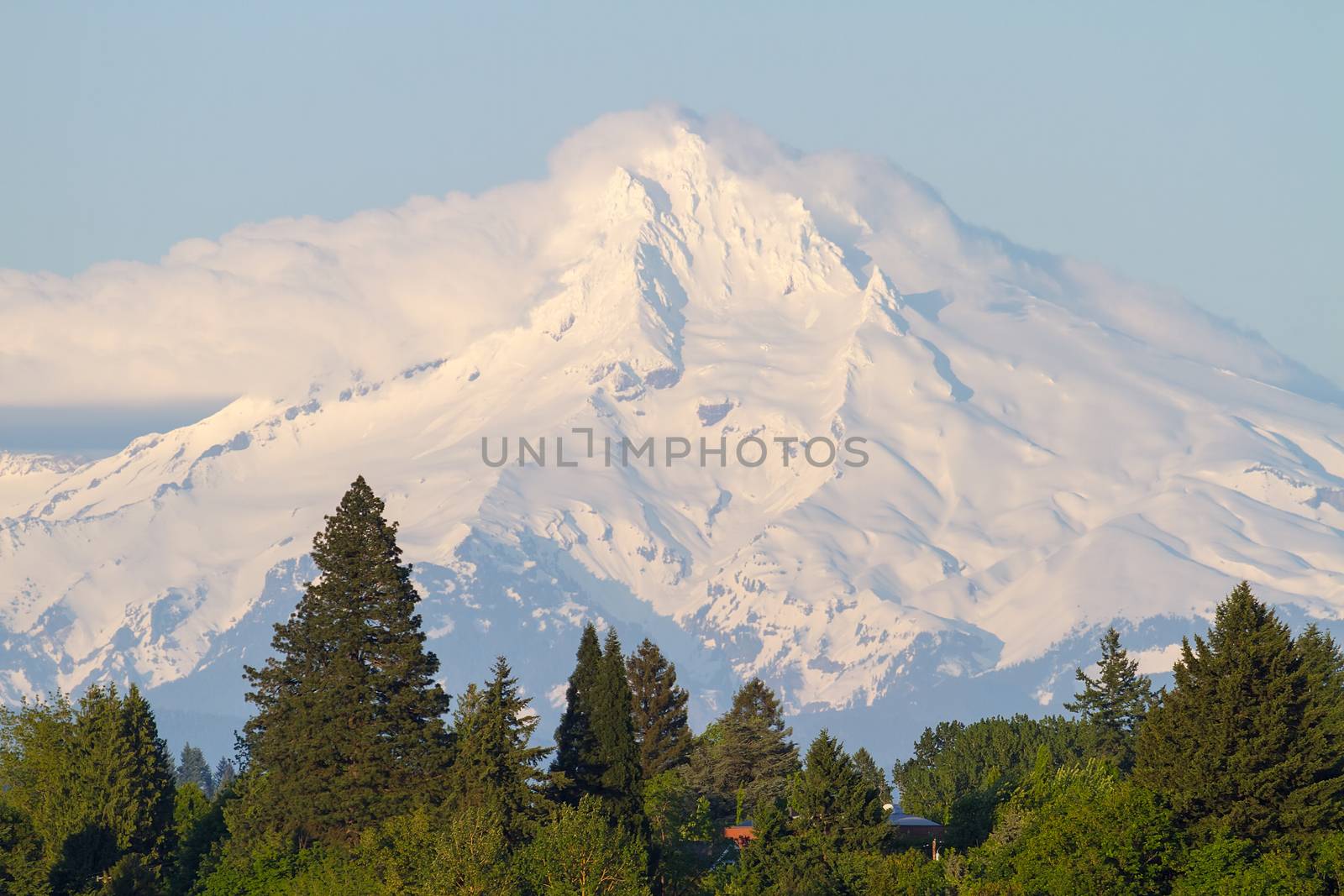 Clouds going over Snow Covered Mount Hood in Oregon National Forest closeup