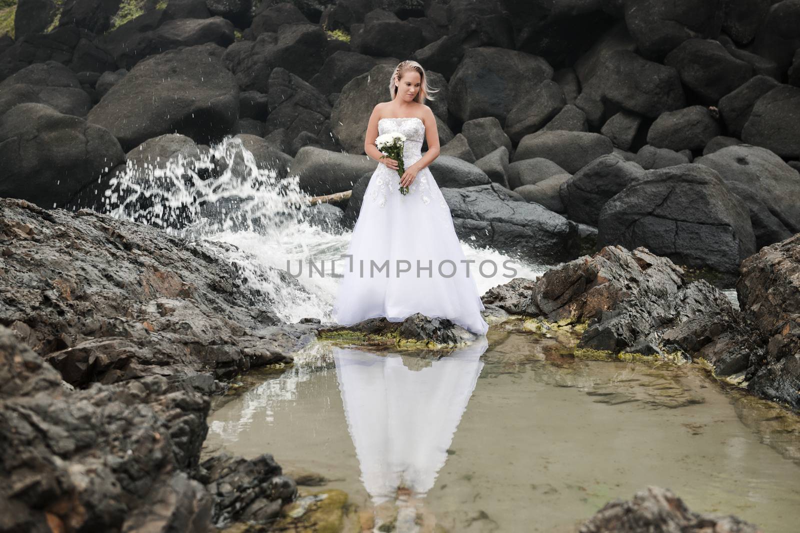 Bride at Snapper Rock beach in New South Wales. by artistrobd