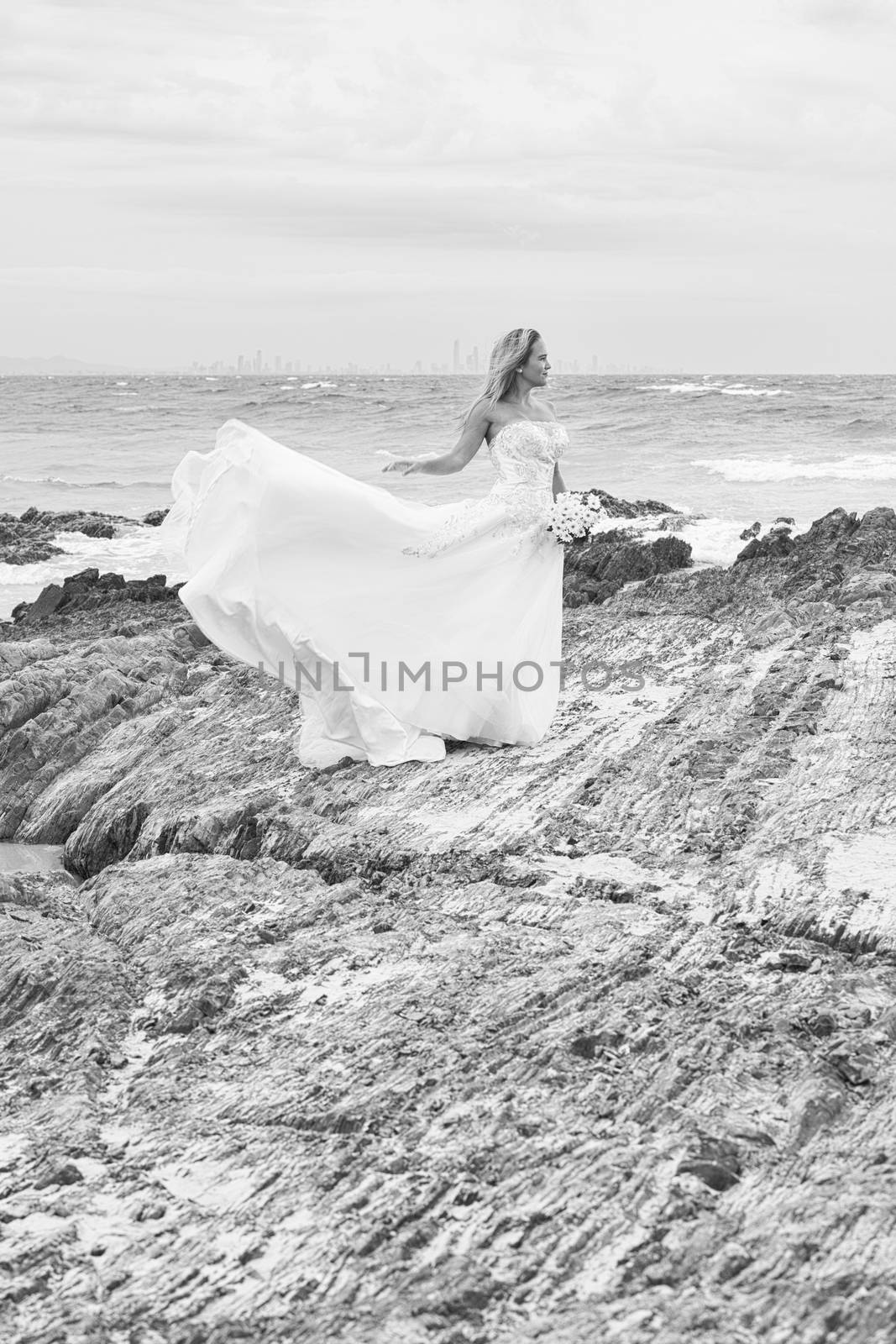 Bride at Snapper Rock beach in New South Wales. by artistrobd