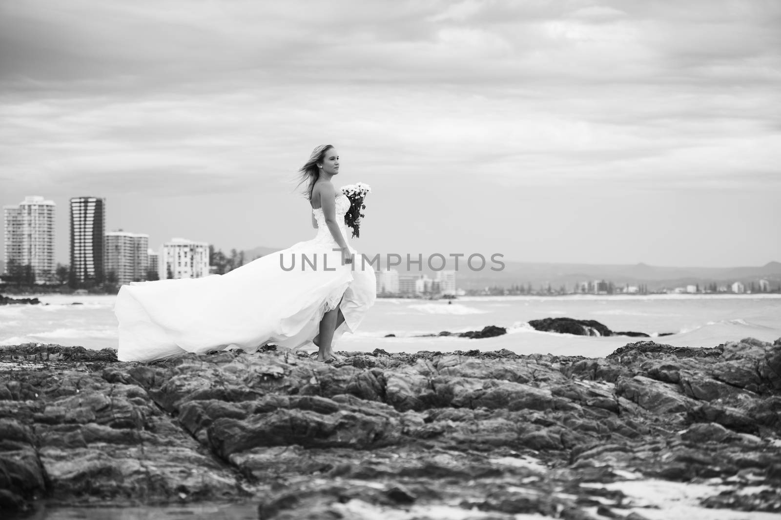 Bride at Snapper Rock beach in New South Wales. by artistrobd