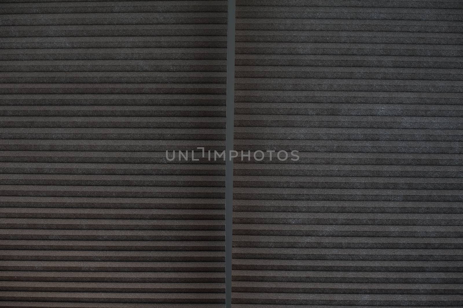 Texture of brown shutters on window in office by timonko