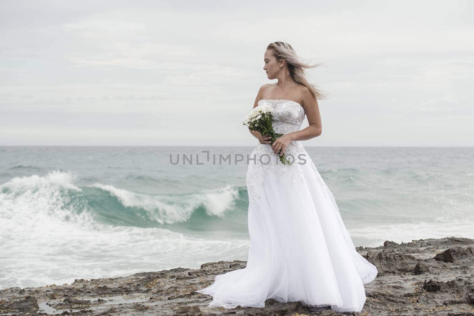 Bride at Snapper Rock beach in New South Wales. by artistrobd