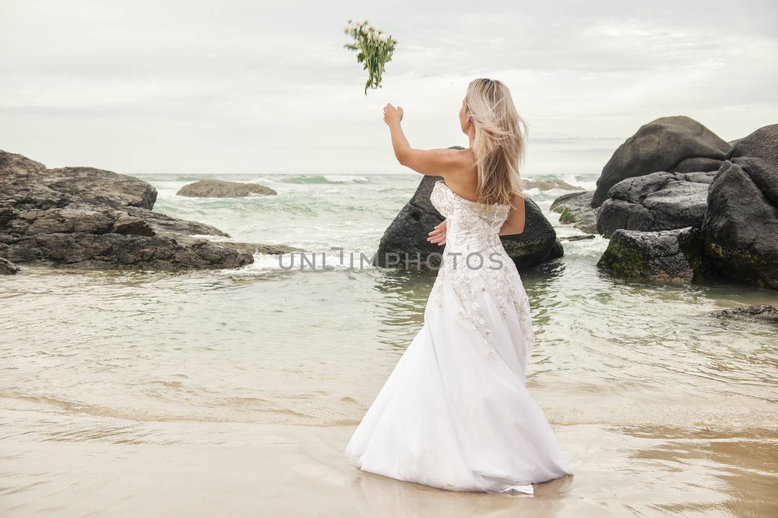 Bride at Snapper Rock beach in New South Wales. by artistrobd