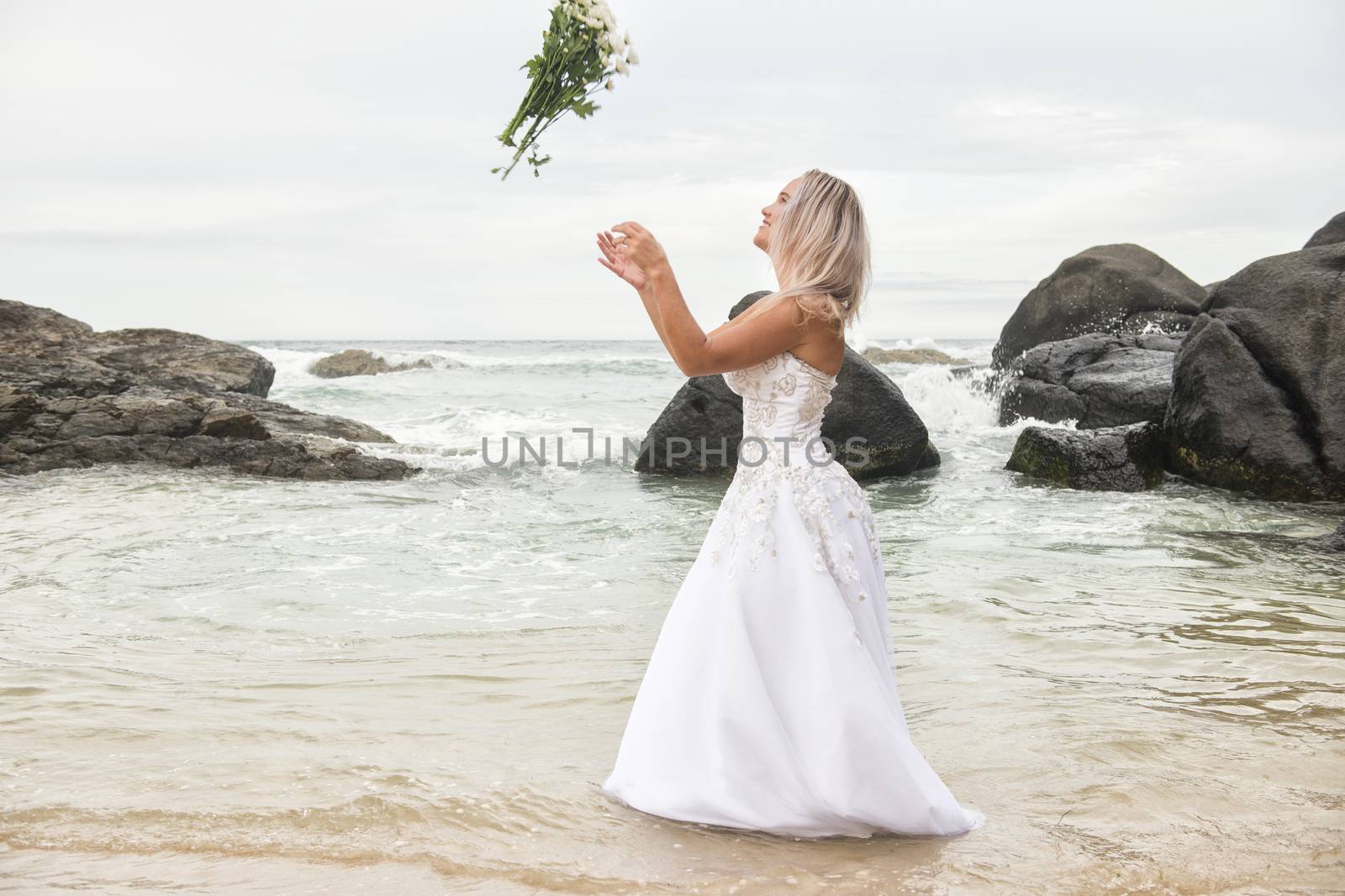 Bride at Snapper Rock beach in New South Wales. by artistrobd