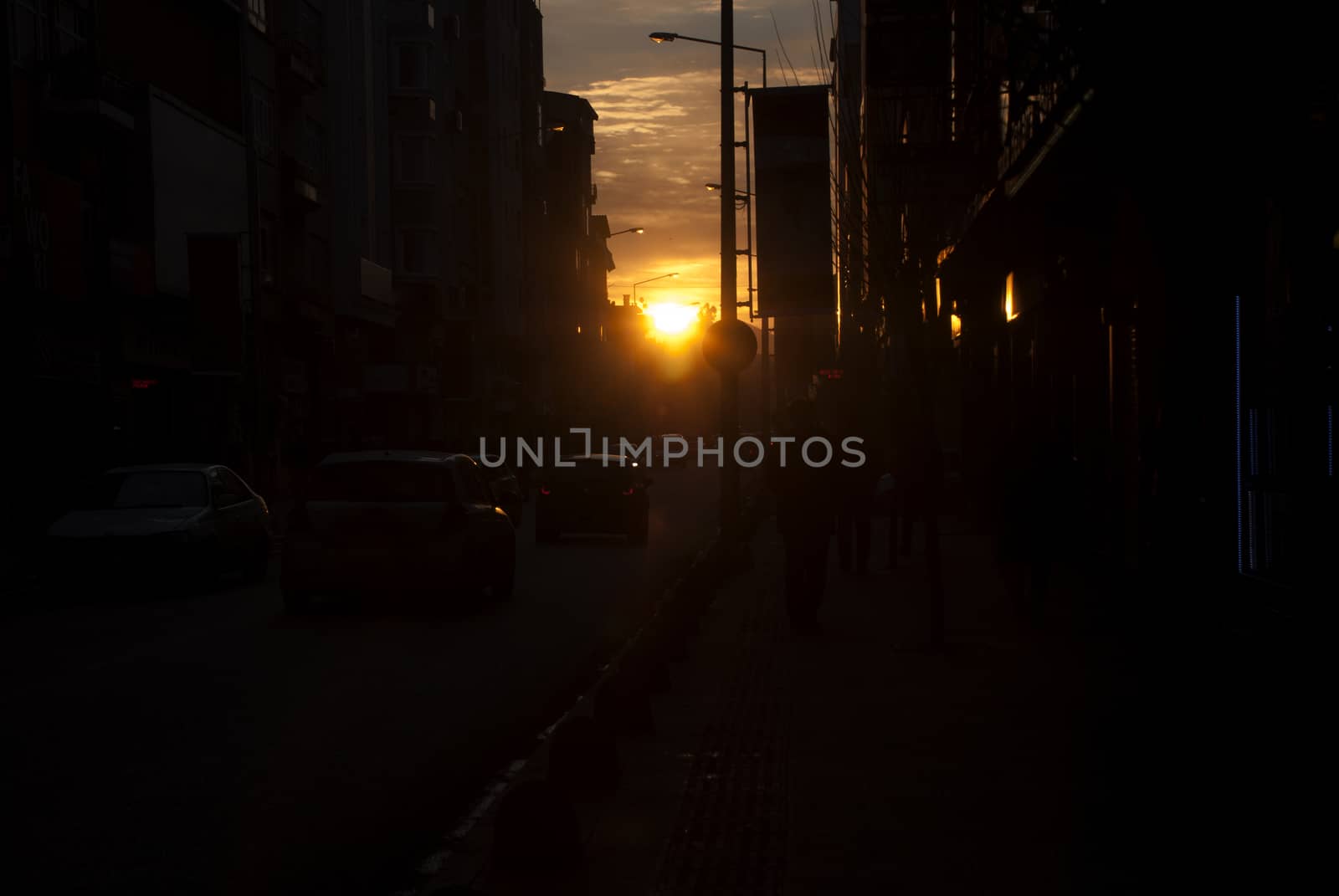 Evening traffic in the crowded city of the evening, beautiful sunset view.