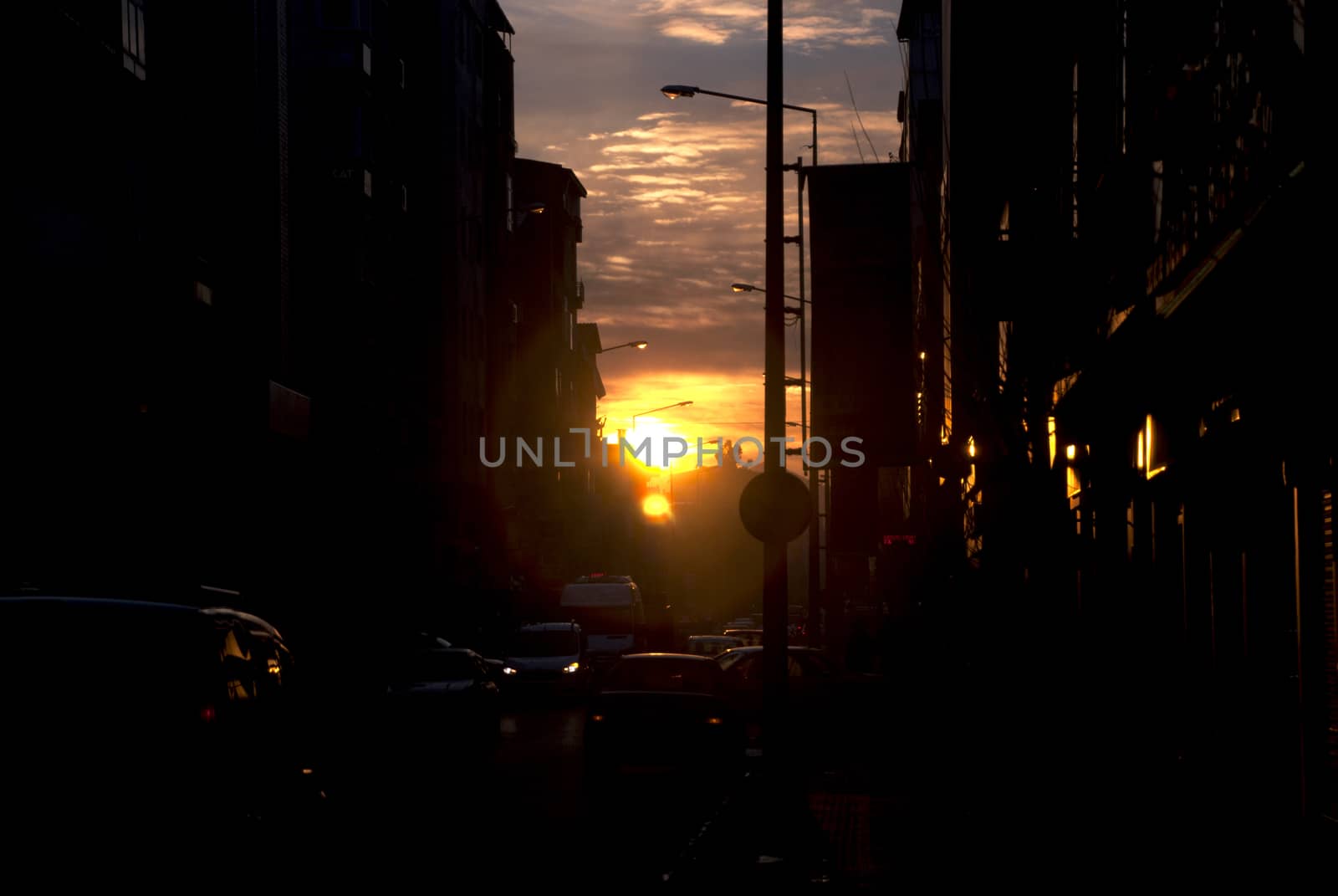 Evening traffic in the crowded city of the evening, beautiful sunset view.