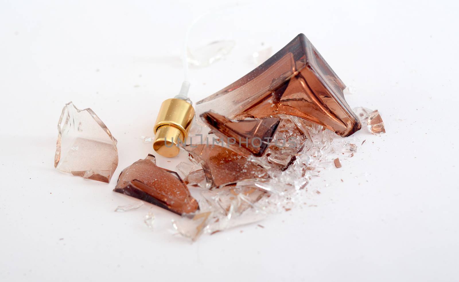 Picture of a Broken perfume bottle onj white