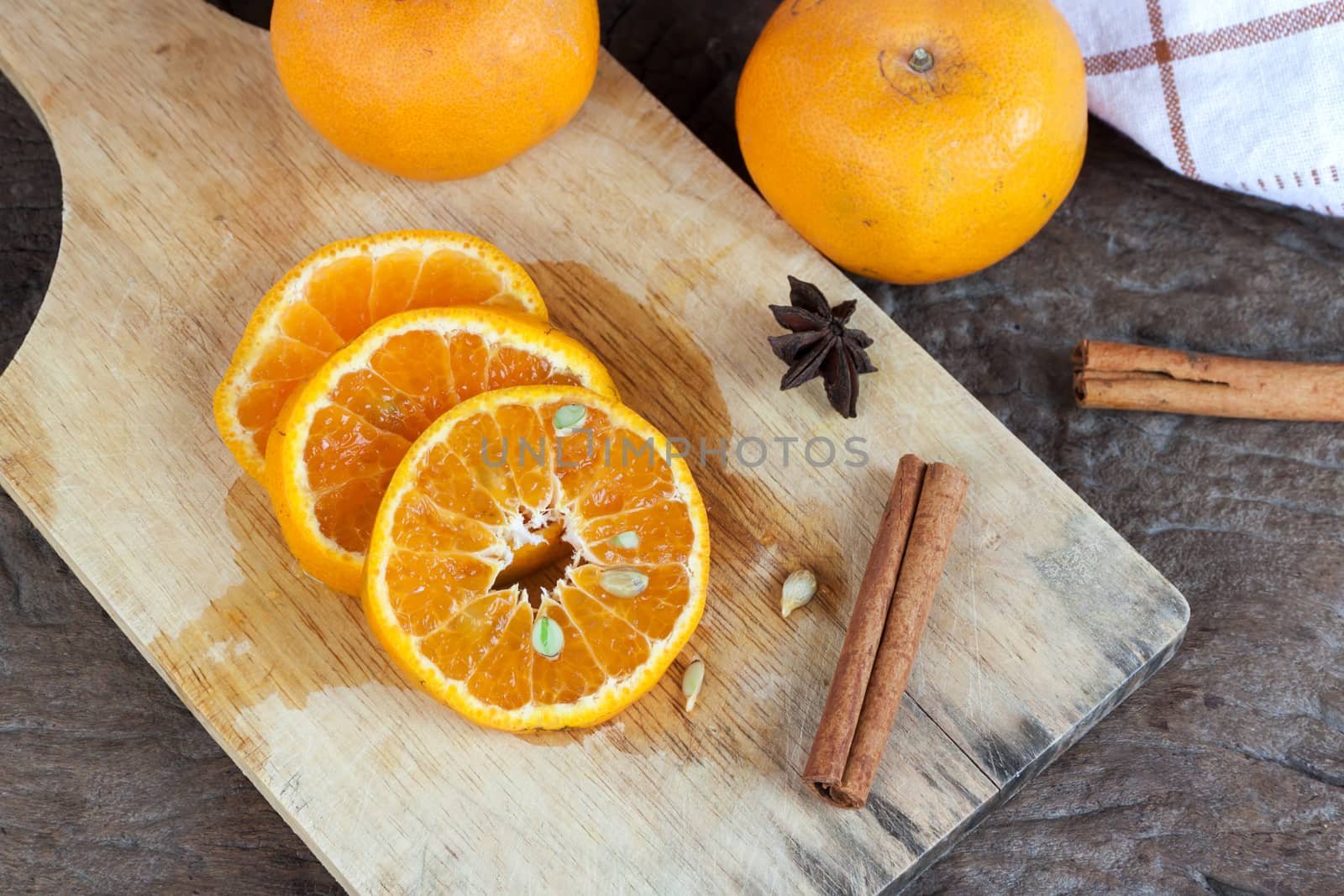 Ripe oranges sliced on oid wood background. Orange in a cut.