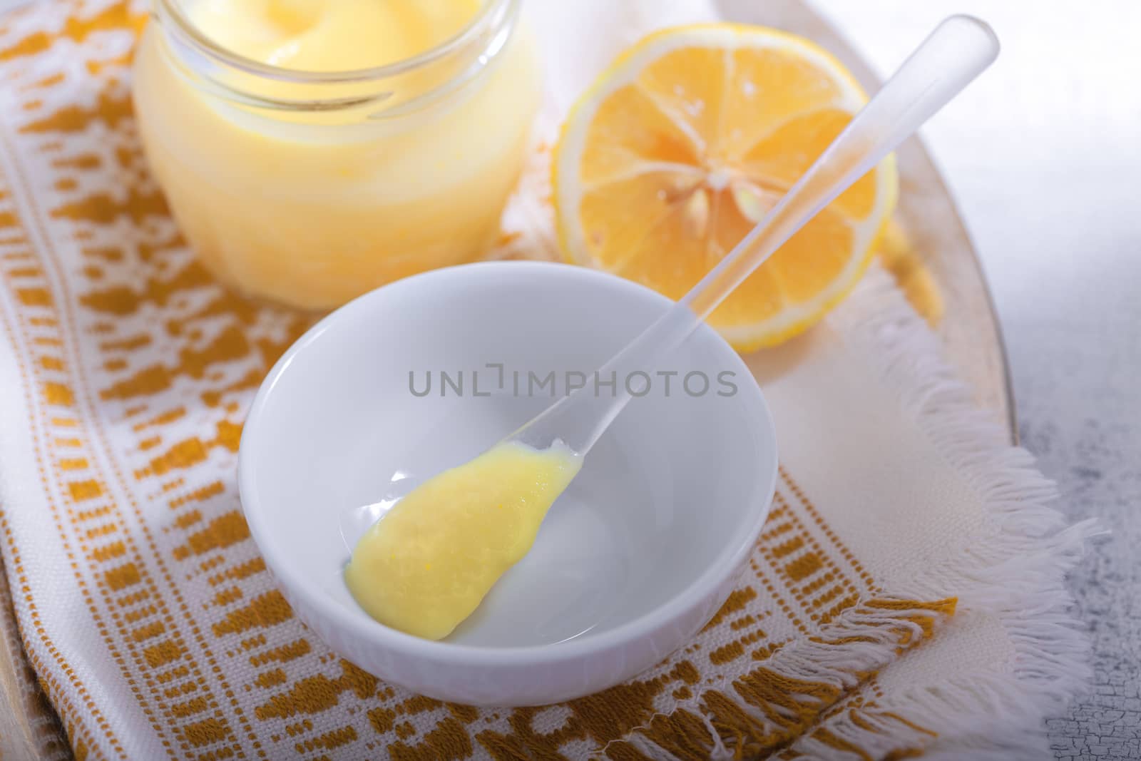 Lemon kurd with a spoon by supercat67