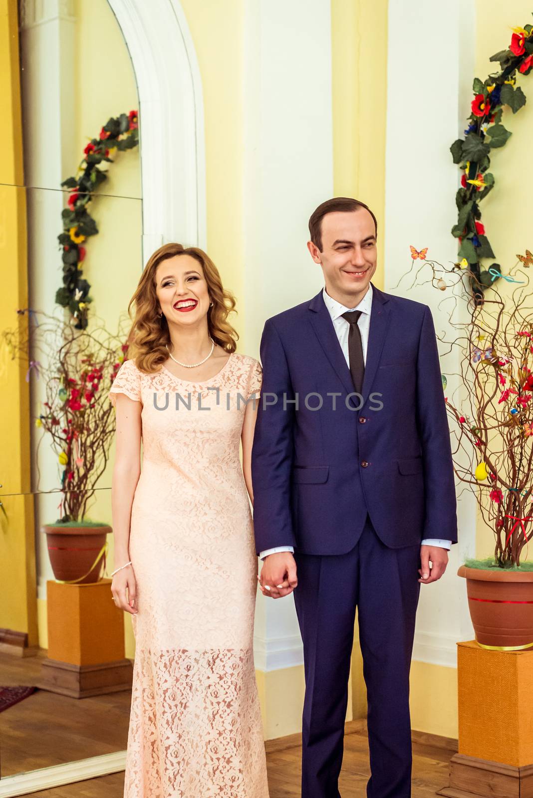 Man and woman in a registry office during the ceremony in Lviv, Ukraine