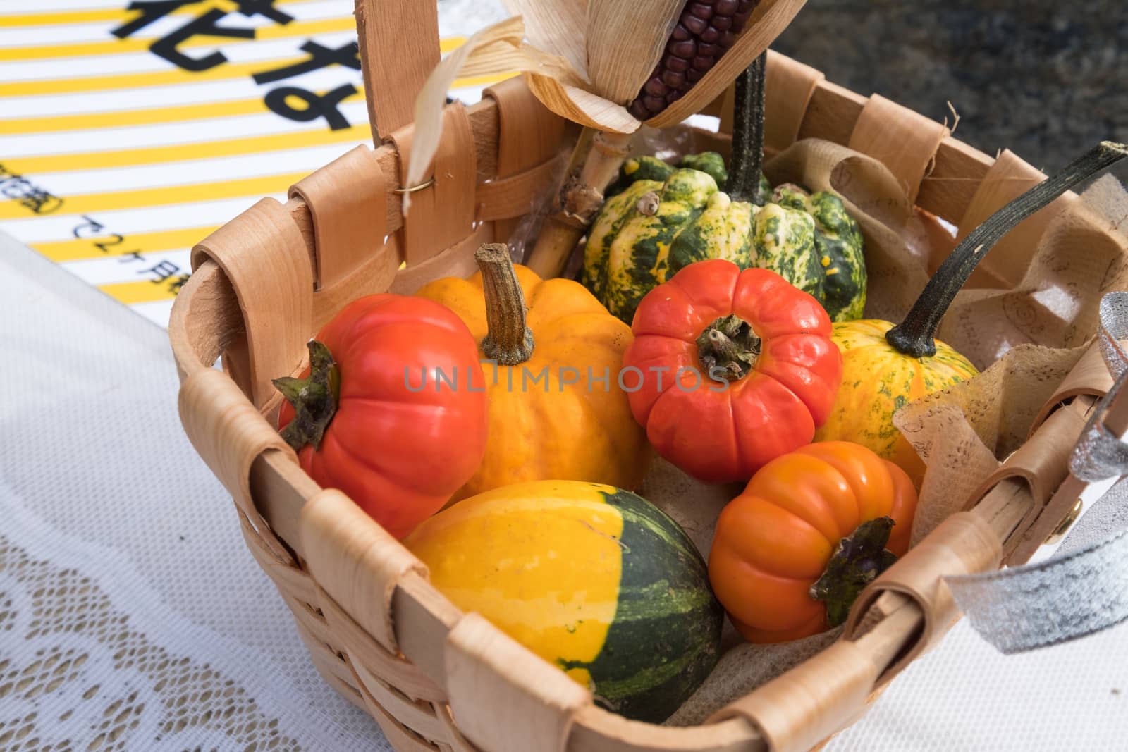 Halloween pumpkins in wooden basket