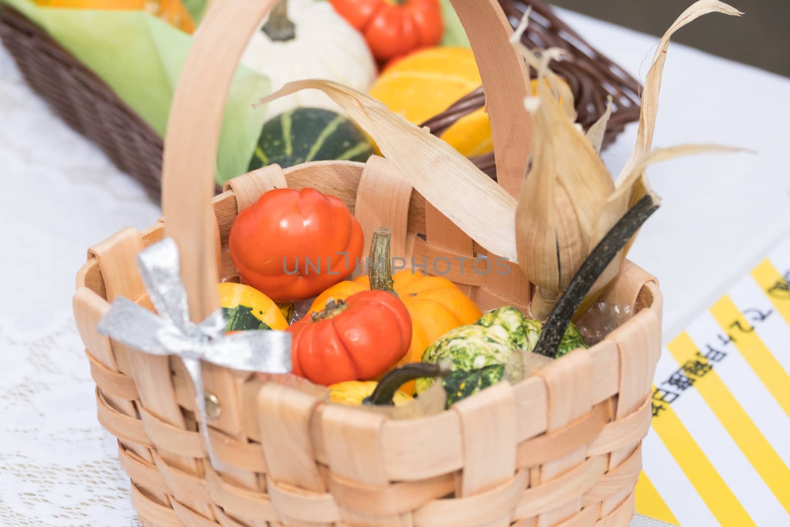 Halloween pumpkins in wooden basket