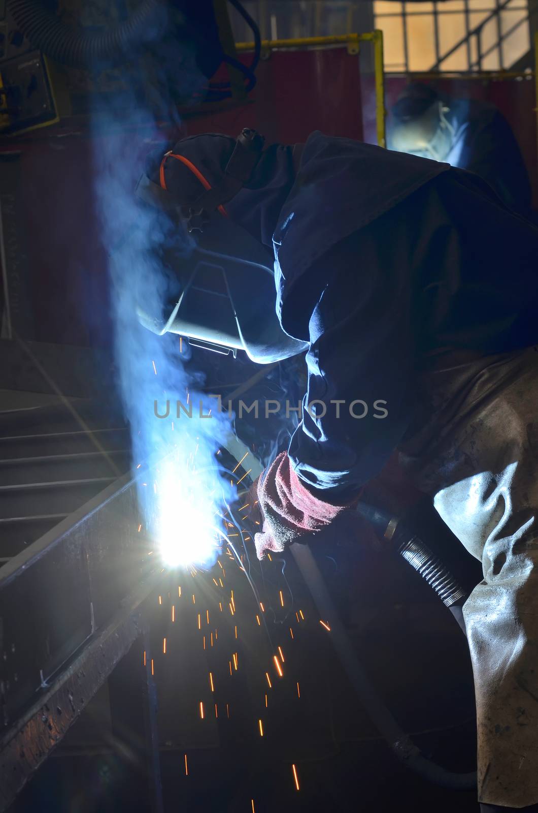 welder welding with mig-mag method