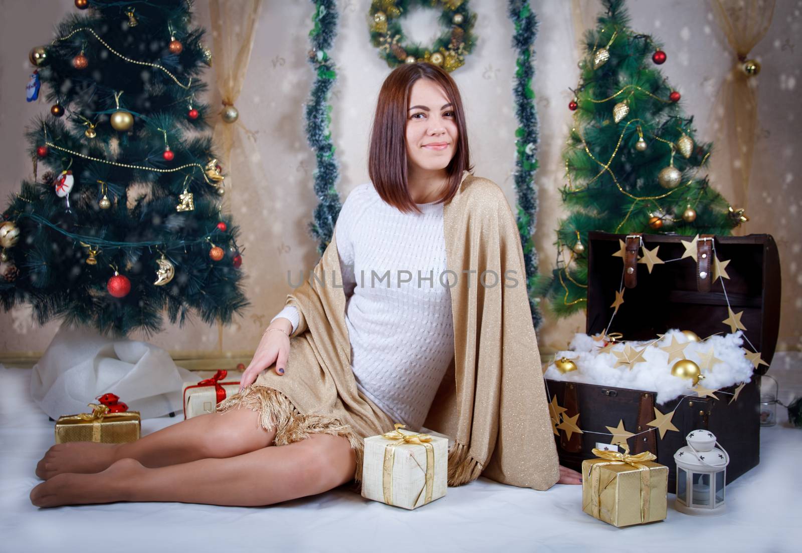 Woman with golden gift under Christmas tree by Angel_a