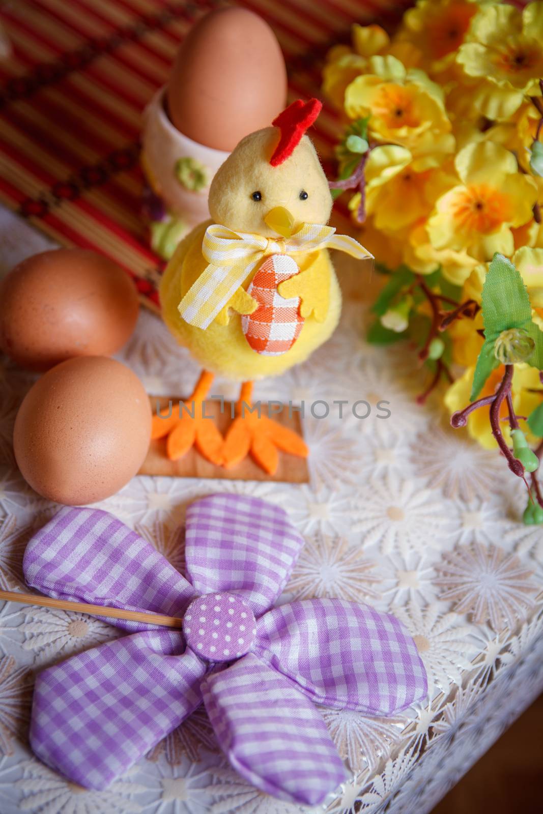 Easter still life with eggs, chicken and flowers