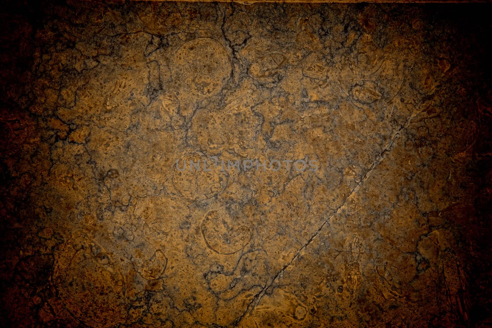 Vignetted stone wall background with lots of texture