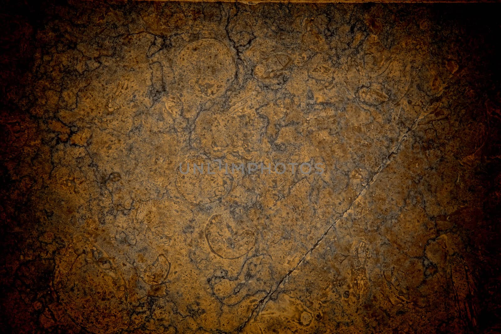 Vignetted stone wall background with lots of texture