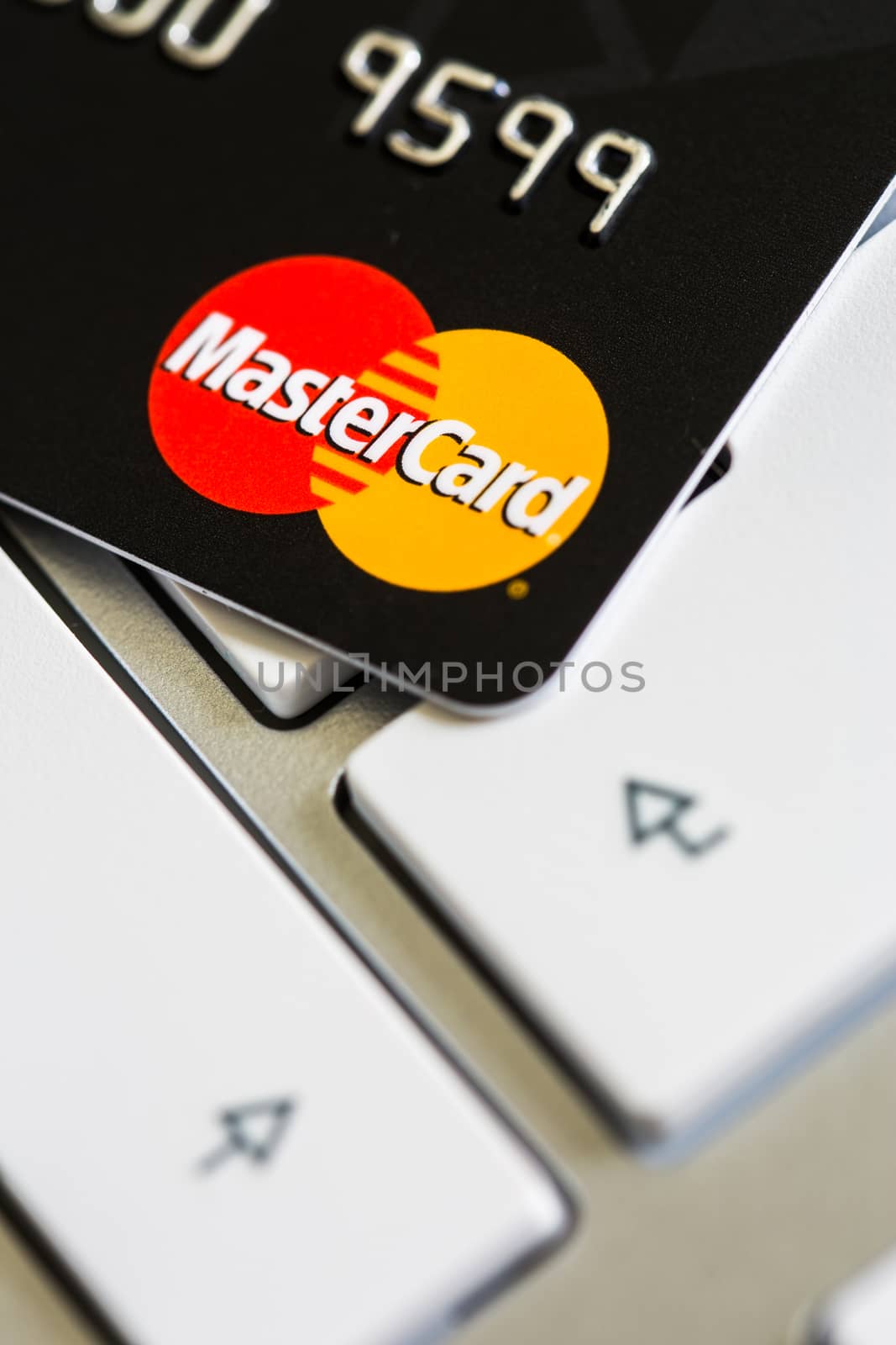 Benon, France - Feb 08, 2017: MasterCard credit card on keyboard, close up photo