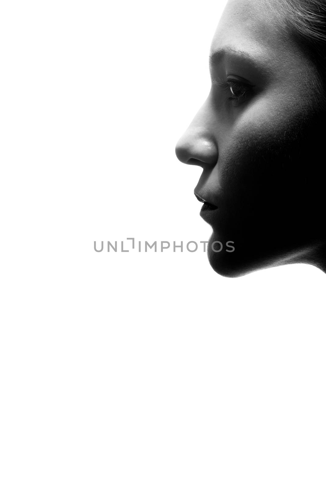 abstract portrait of attractive caucasian girl in shadows