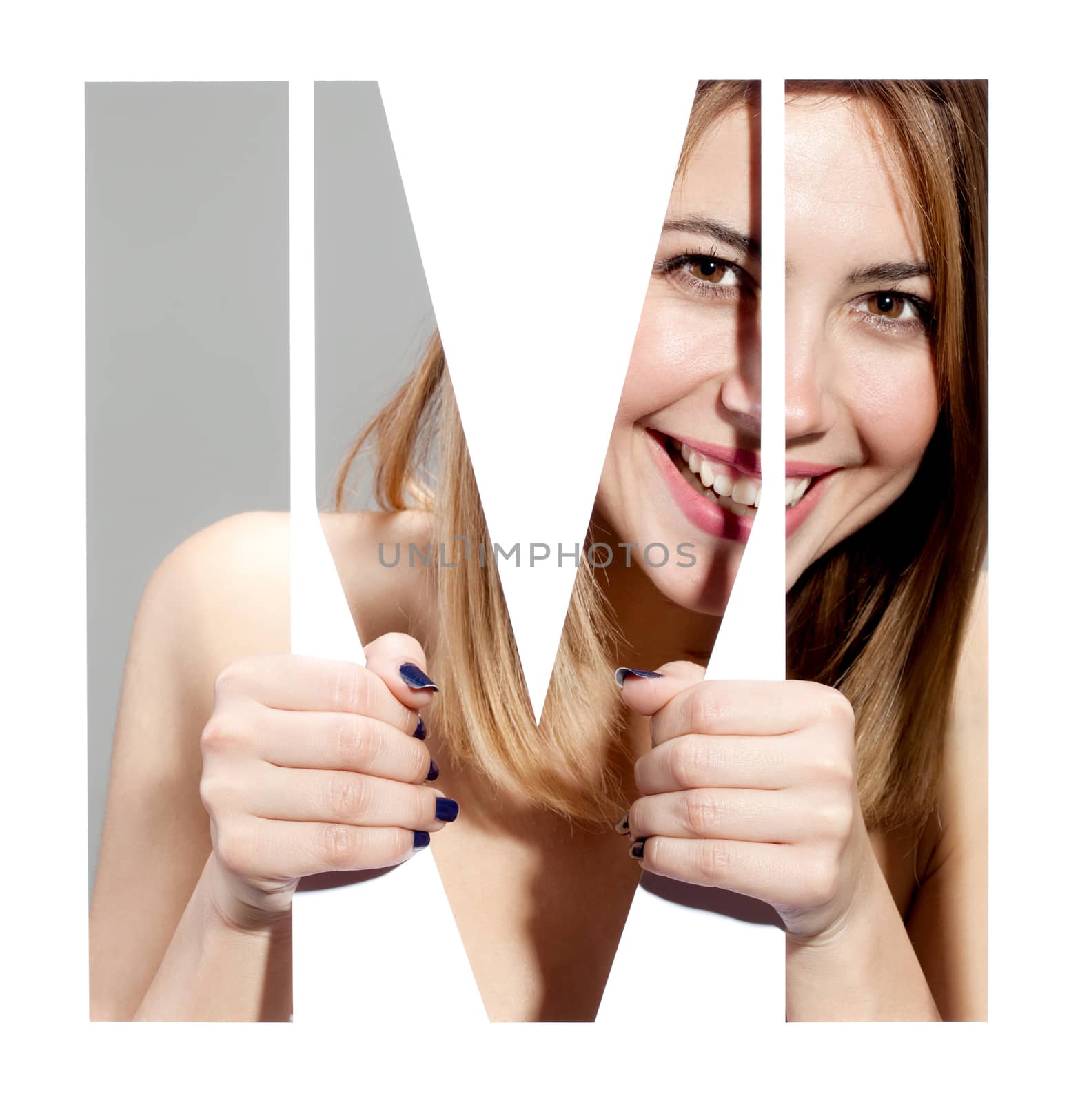 girl hiding behind and holding the letter "M"