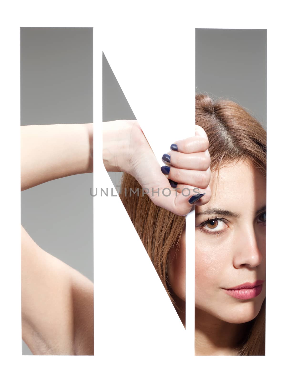 girl hiding behind and holding the letter "N"