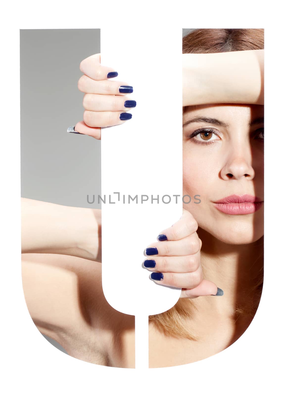 girl hiding behind and holding the letter "U"