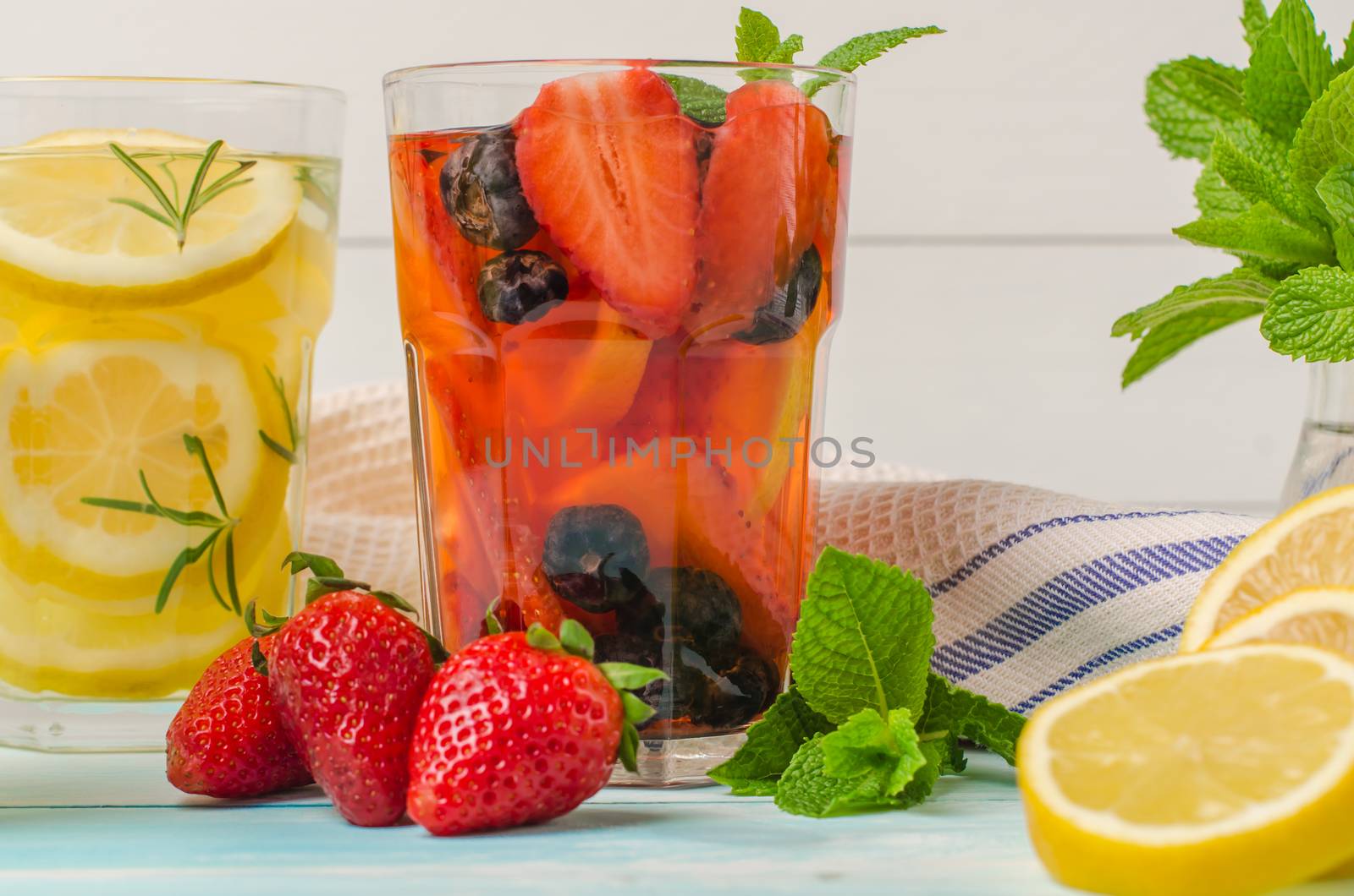 Detox fruit infused flavored water. Refreshing summer homemade cocktail