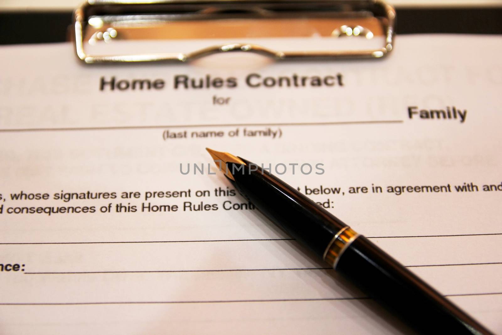 The form of the contract with a black pen on a white background