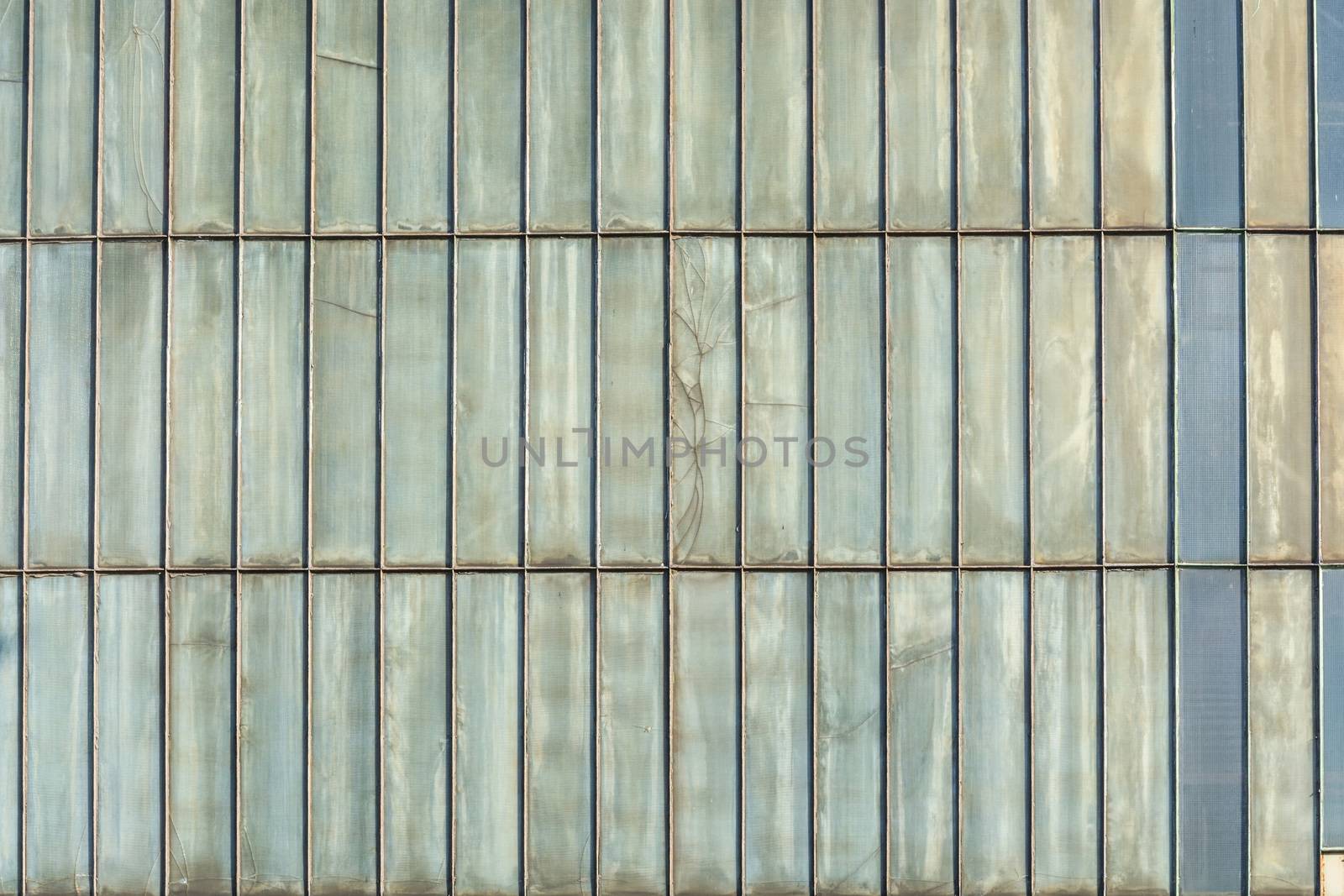 Silver-colored metal wall corrugated sheet metal background.