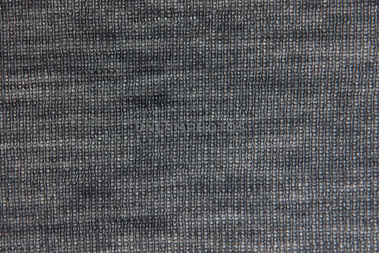 Close up on knit woolen fur texture. gray fluffy woven thread sweater as a background. Black and white photography