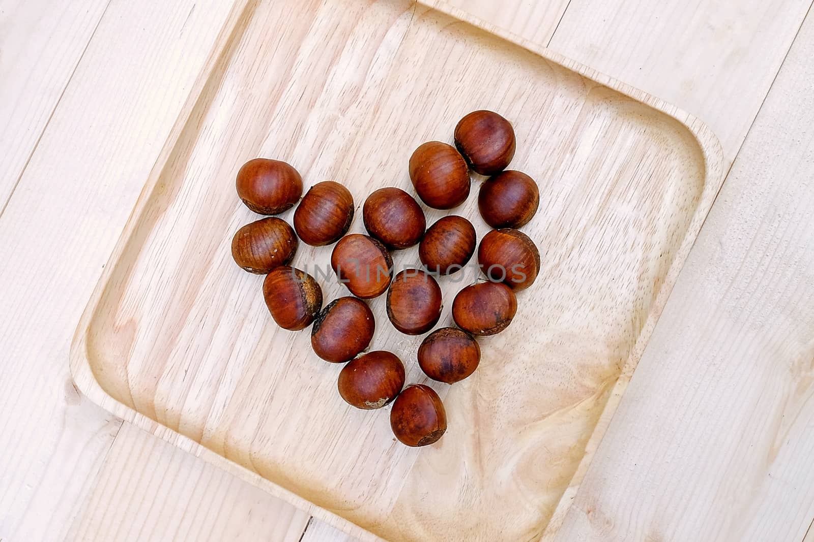 Chestnut in dish Wooden on the Table by aonip