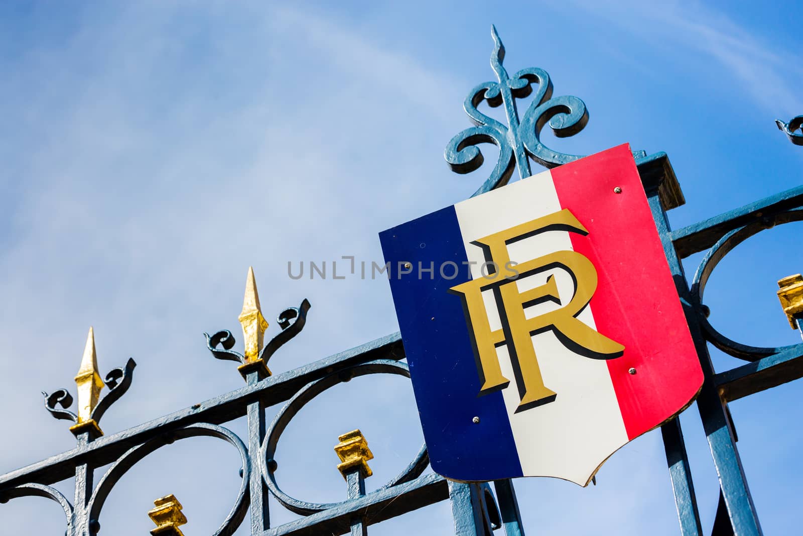 Paris, France - March 27, 2017: Gate with golden decoration and french flag. Predidential elections concept