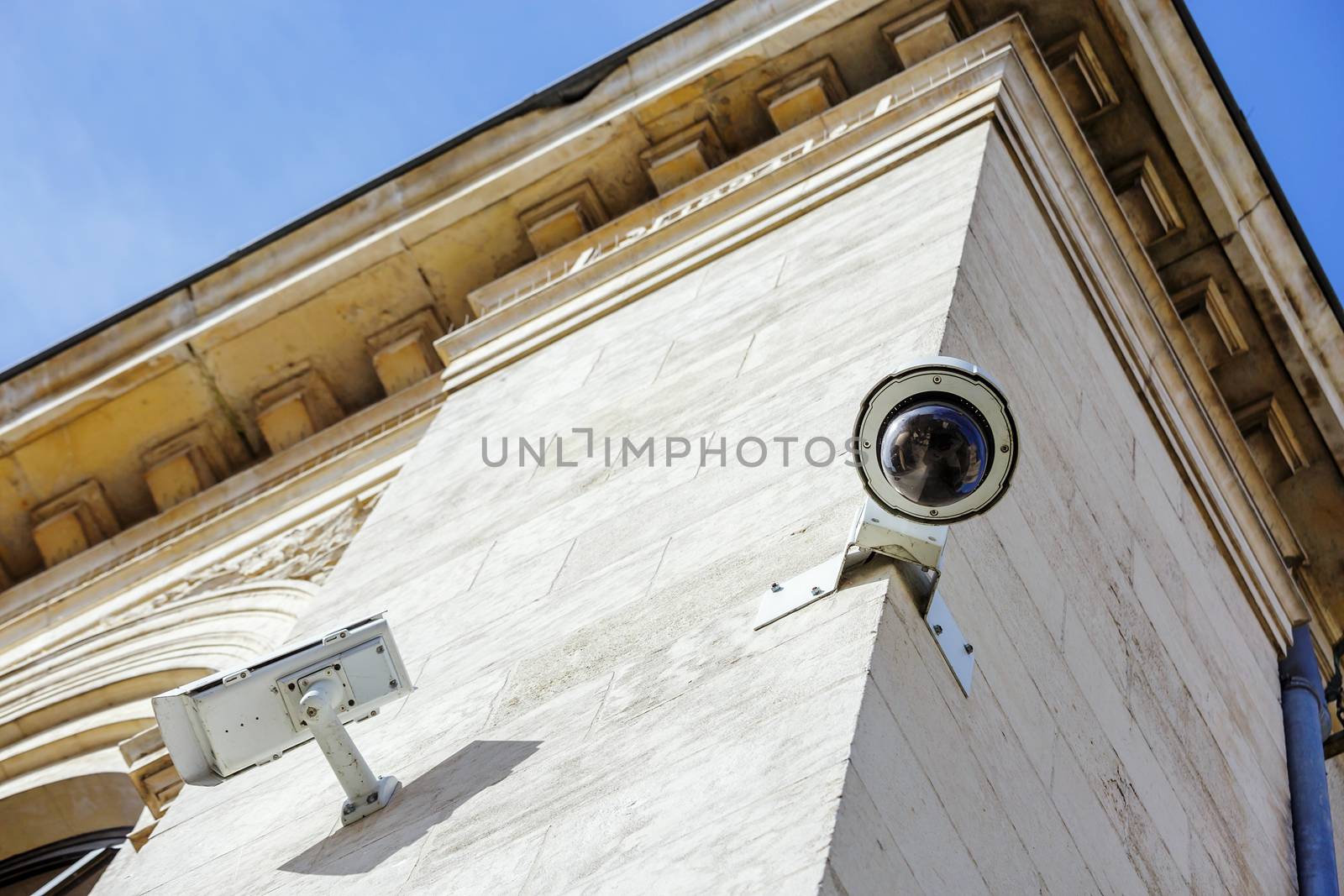 security CCTV camera or surveillance system fixed on old constru by pixinoo