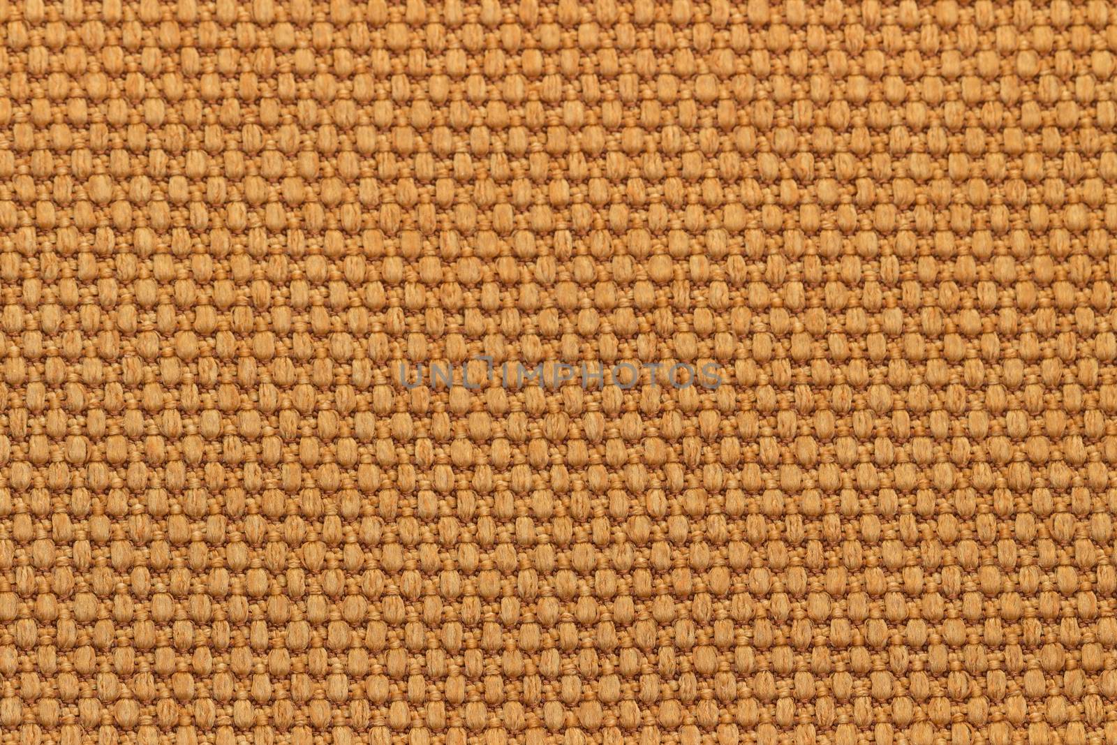 Rustic canvas fabric texture in orange color.