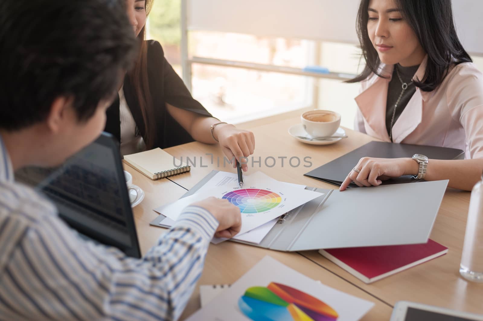 Asian businesspeople discussing and brainstorm about their projects together in meeting room. Business startup teamwork concept