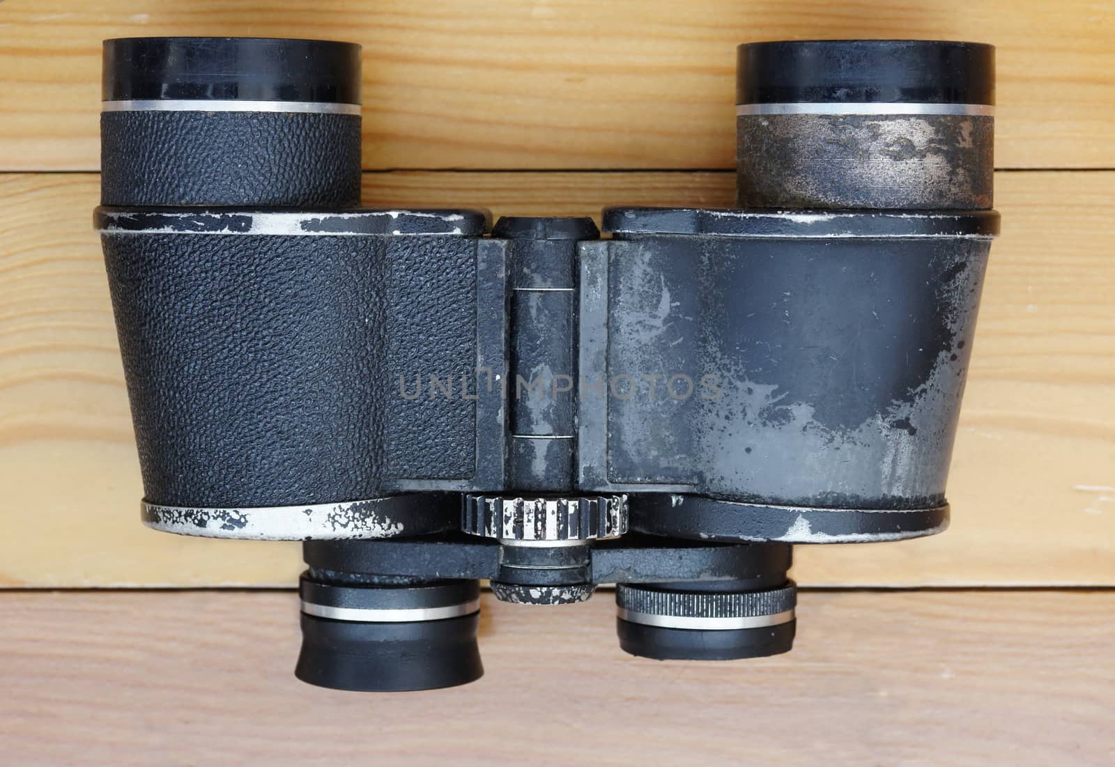 Old military binoculars on table by mrivserg