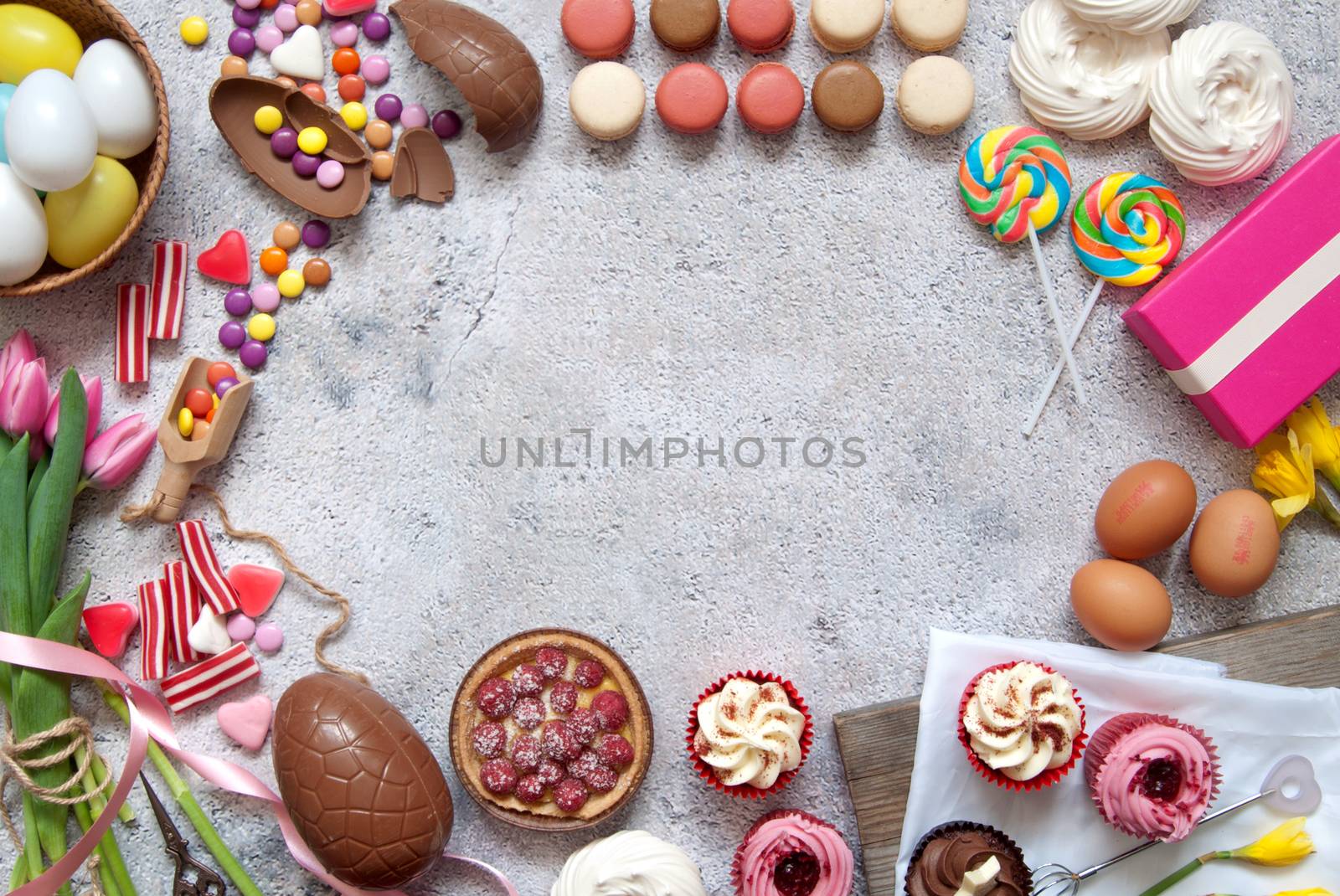 Assorted easter sweets, bakery cupcakes, chocolate eggs and confectionery 