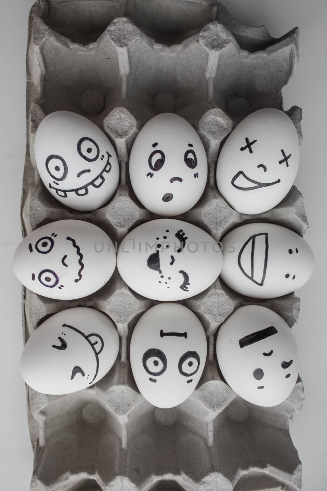 Eggs with faces photo for your design. in the box by xenium