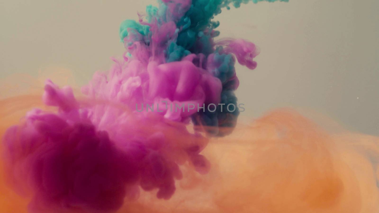 Close up of three colors of ink dropped into the water