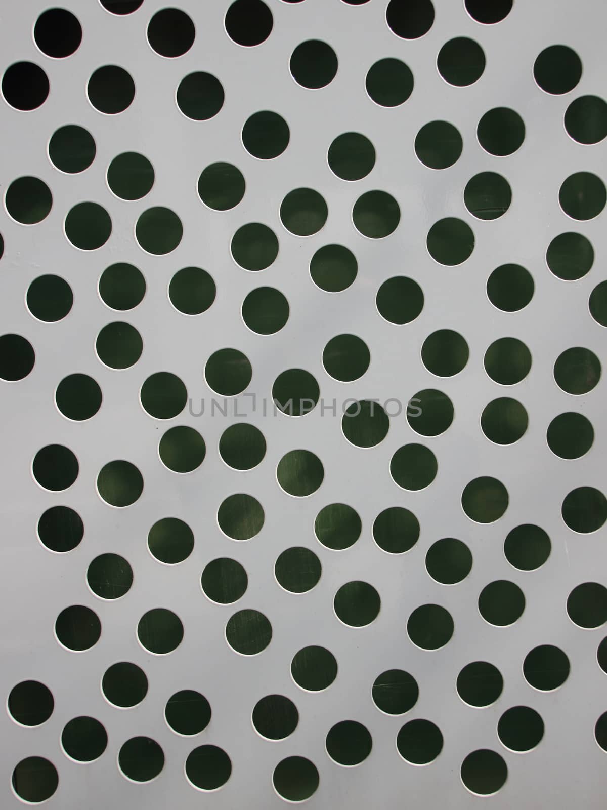Grey Metal Plate Background with Random Drilled Holes