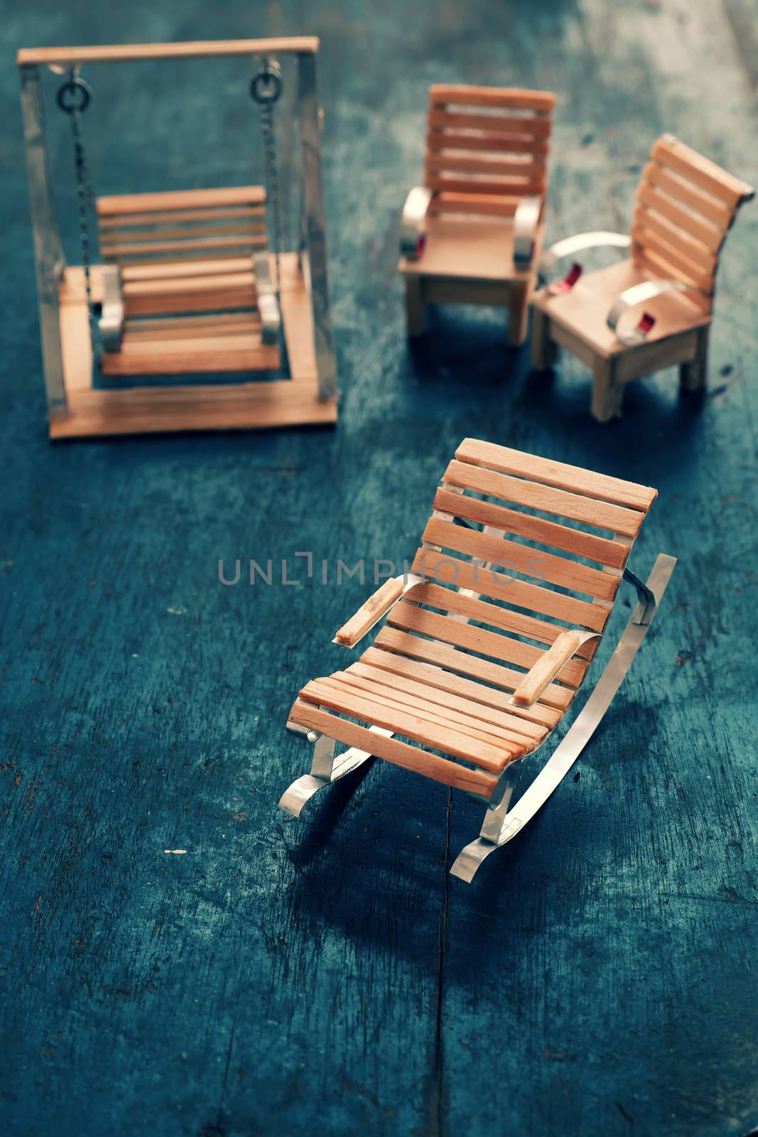 Amazing miniature handmade product for interior design, mini furniture make from wood stick on wooden background, small chair so cute, a hobby leisure