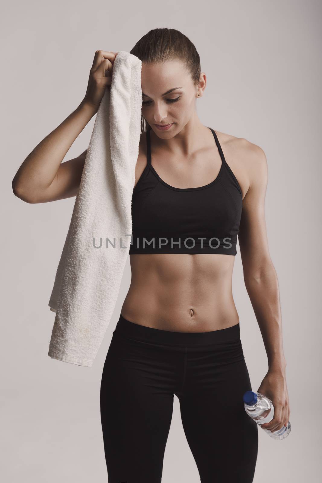 Portrait of sporty young woman tired after a gym workout