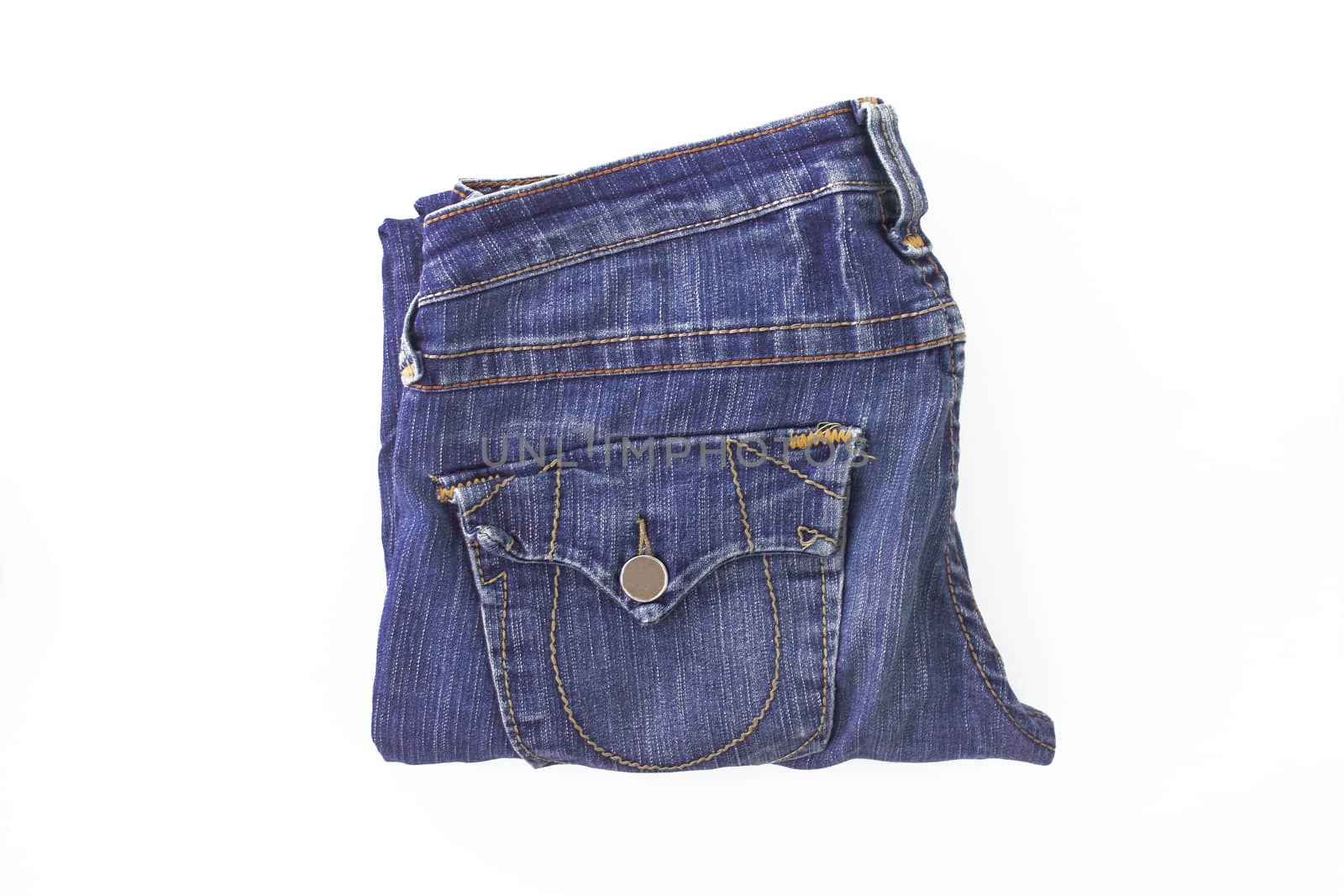 Purple, violet retro jeans neatly folded, isolated.