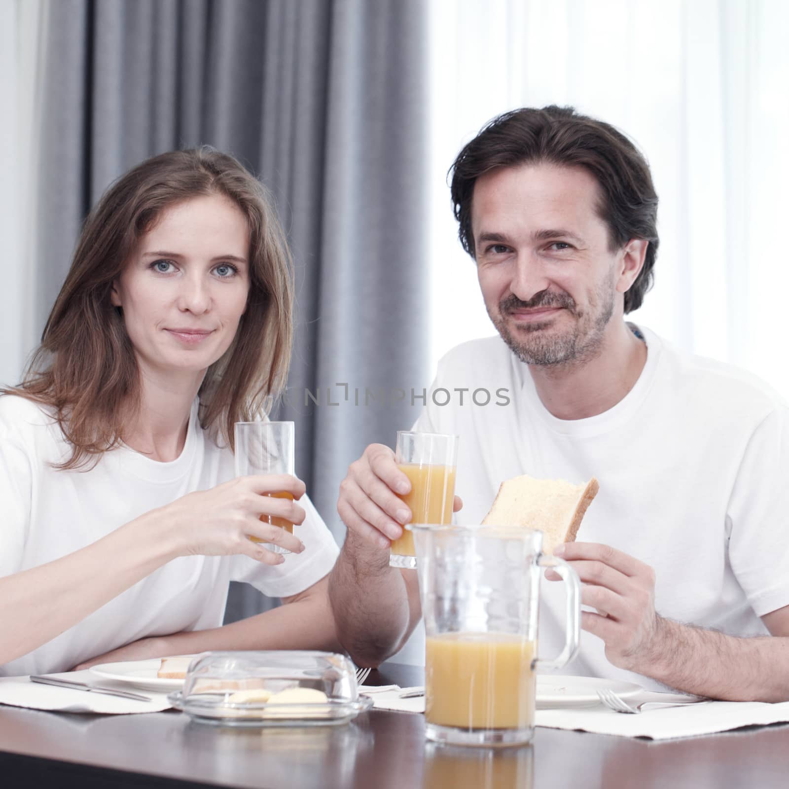 Couple having breakfast  by ALotOfPeople