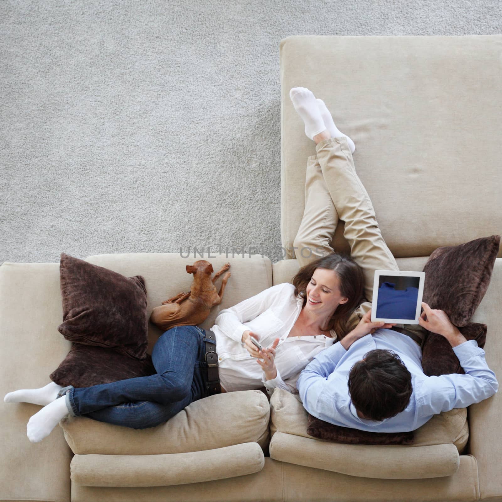 Couple using tablet  by ALotOfPeople