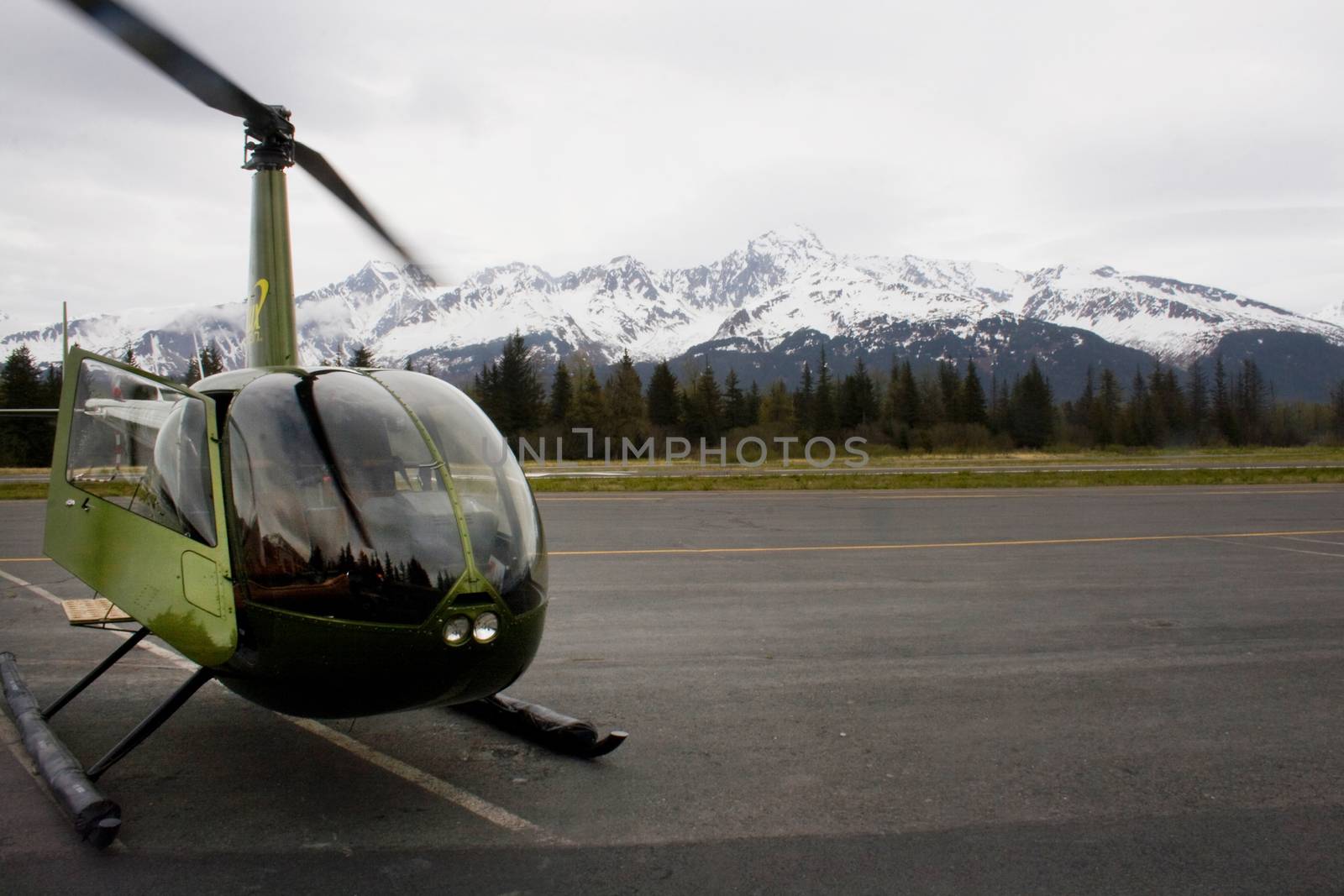 Green Helicopter on Runway in Seward Alaska by NikkiGensert