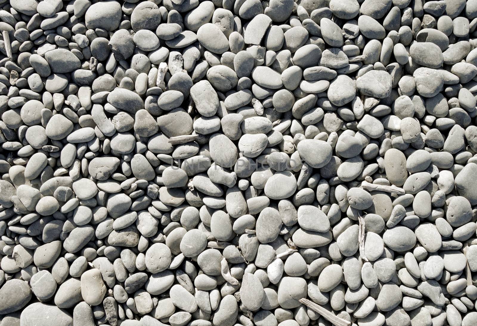 pebbles on a beach background texture wallpaper                               