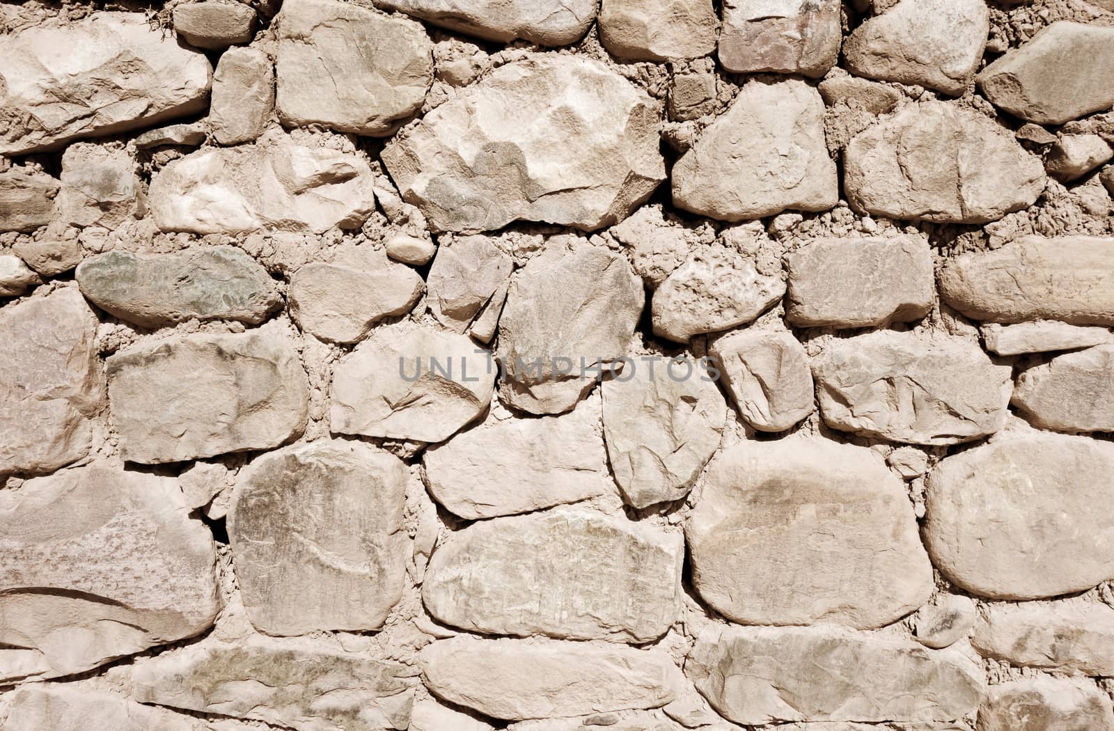 Old rough stone wall, background wallpaper                               