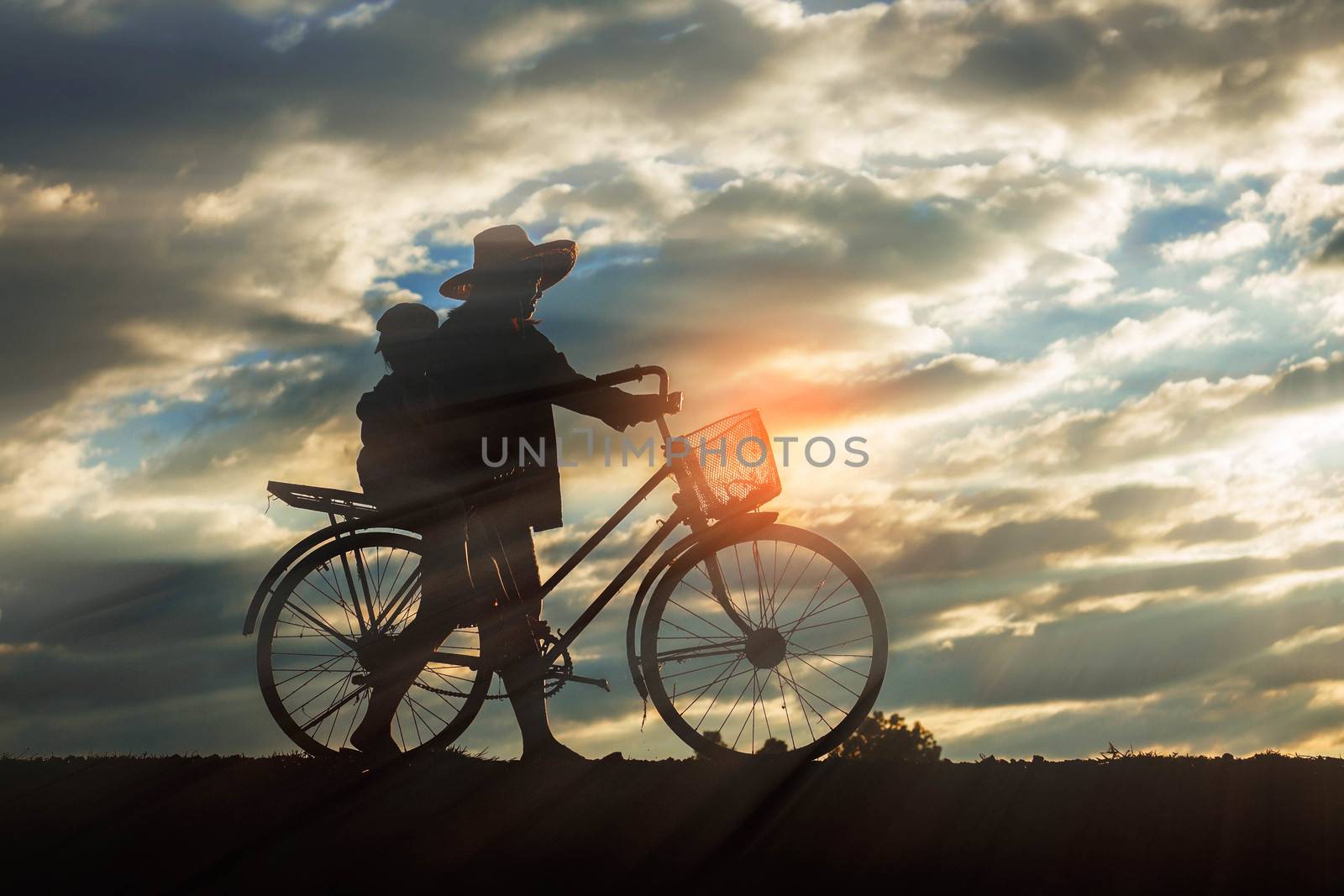 farmer with bicycle on a field. by start08