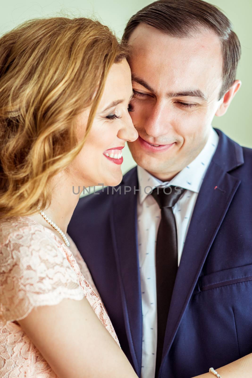 Close up portrait of happy husband and wife after the ceremony in a registry office in Lviv, Ukraine